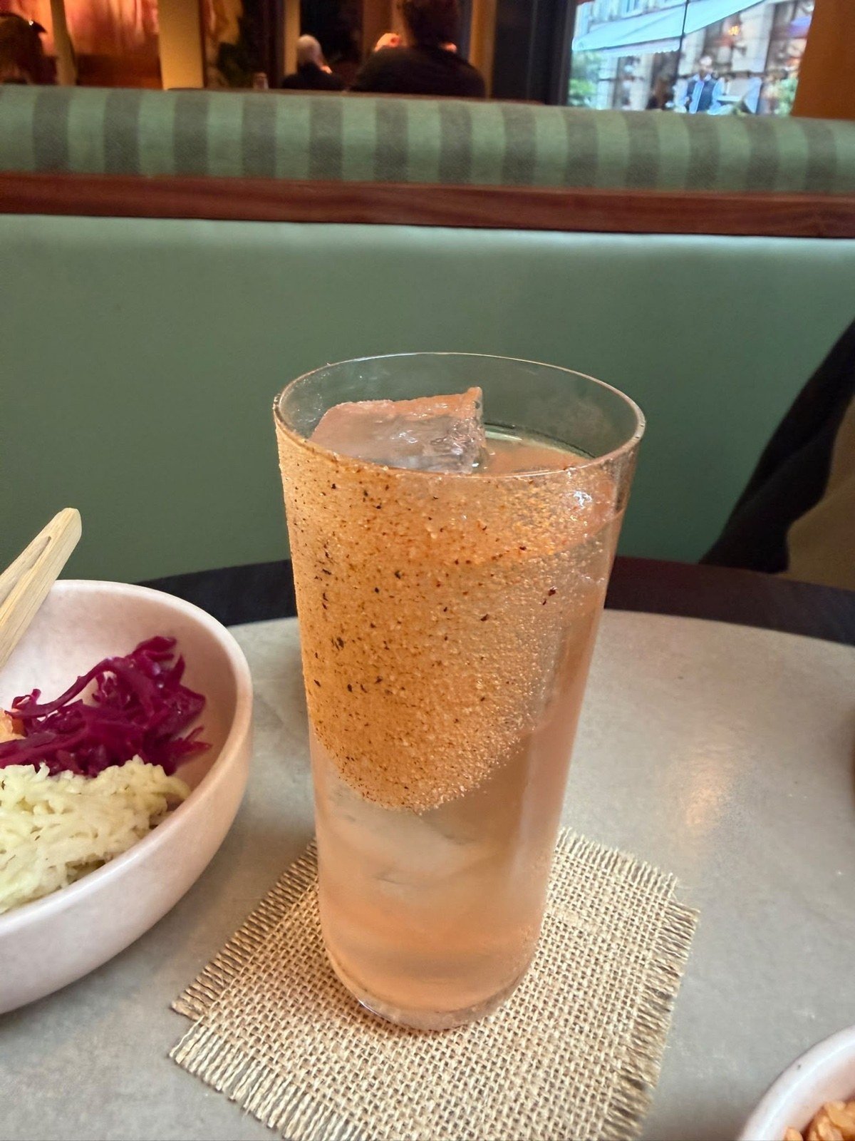 A cocktail with a seasoned rim
